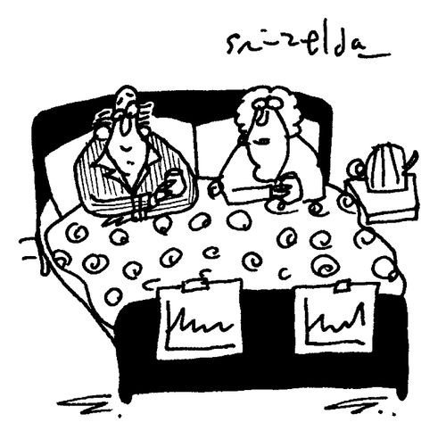 Couple in bed with health charts