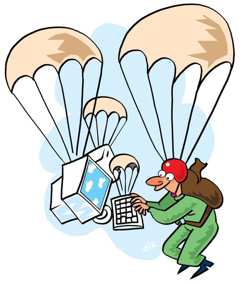 Parachutist using computer in freefall, also using a parachute.