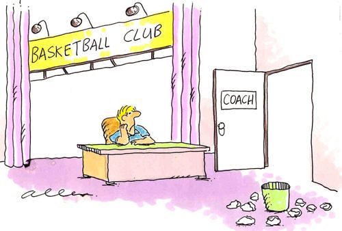 Coach of basketball club sitting in his office with papers he has thrown all round the waste bin.