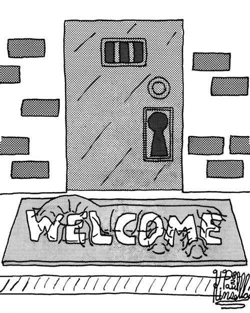 Welcome mat with large lumpy key under it.
