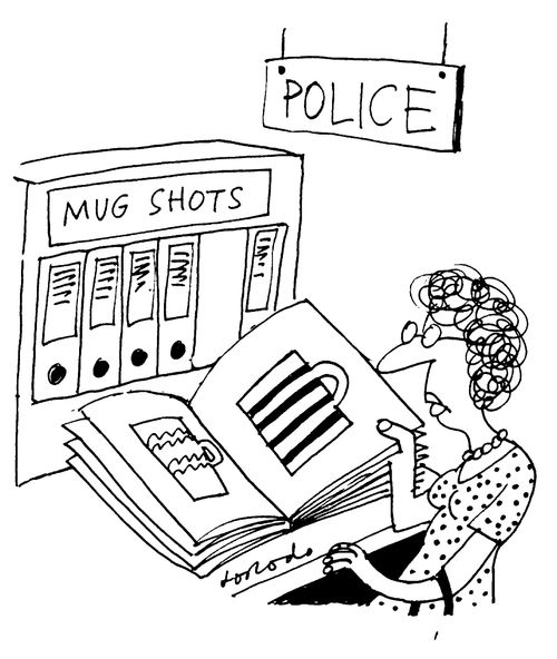 Woman looking at catalogue of cups - Police mug shots