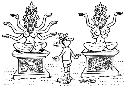 Man looking at 2 stone godesses, one with many arms, one with many breasts.