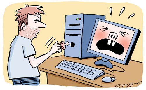 Stressed man puts baby dummy into computer to stop it crying.