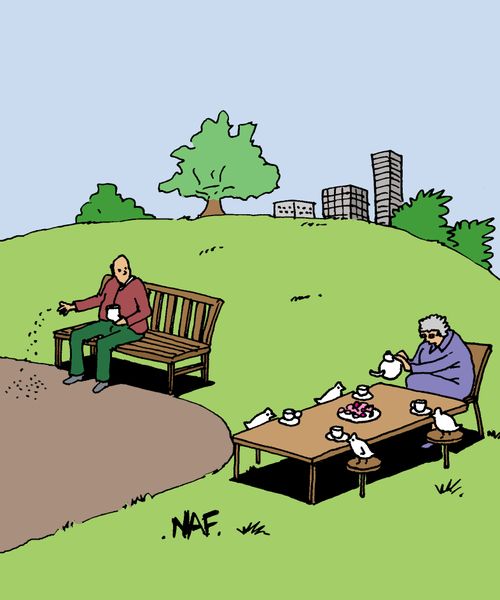 Old lady feeding birds at a dining table in park.