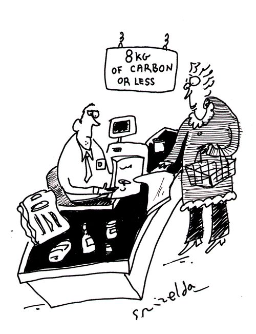 Woman at checkout signposted '8kg of carbon or less.'