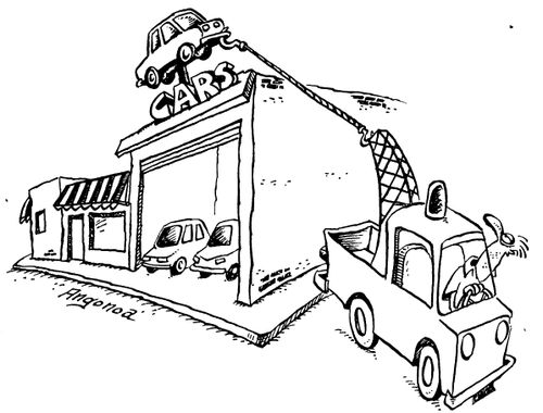 Towing truck pulling car from top of car show room