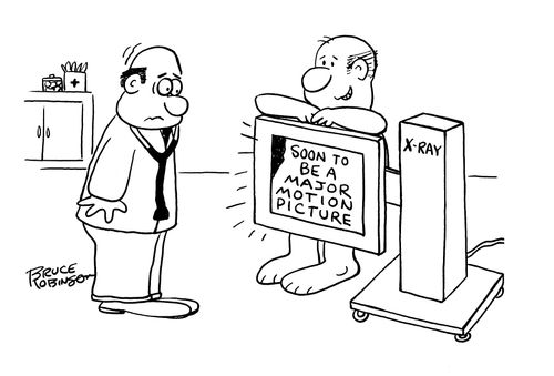 Surprised doctor looking at man standing behind X-Ray machine with the image saying: SOON TO BE A MAJOR MOTION PICTURE.