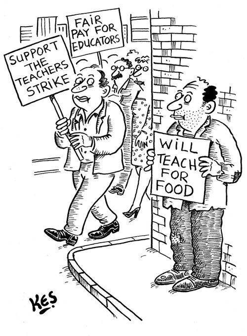 Striking teachers march as man stands with sign: 'Will teach for food'.