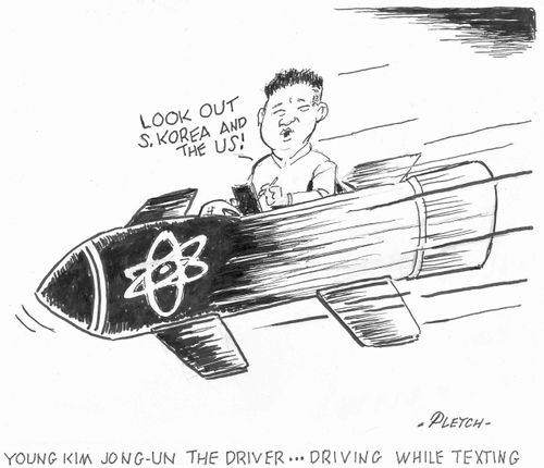 Young Kim Jong-Un the driver...driving while texting.