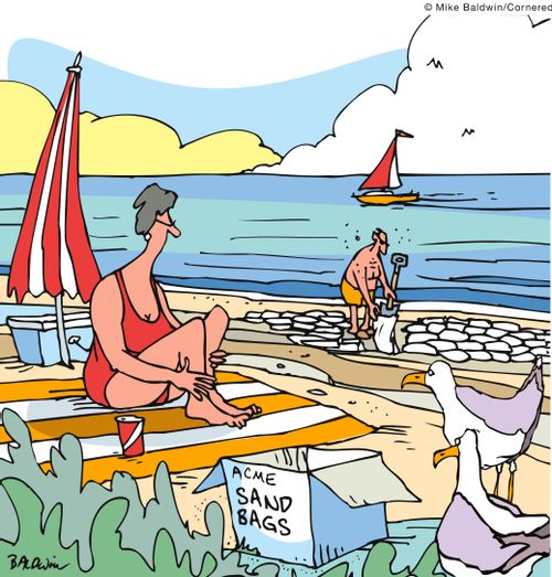 Man goes to the beach to fill sandbags.