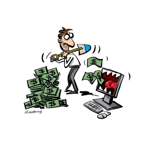 Man feeding his computer money.