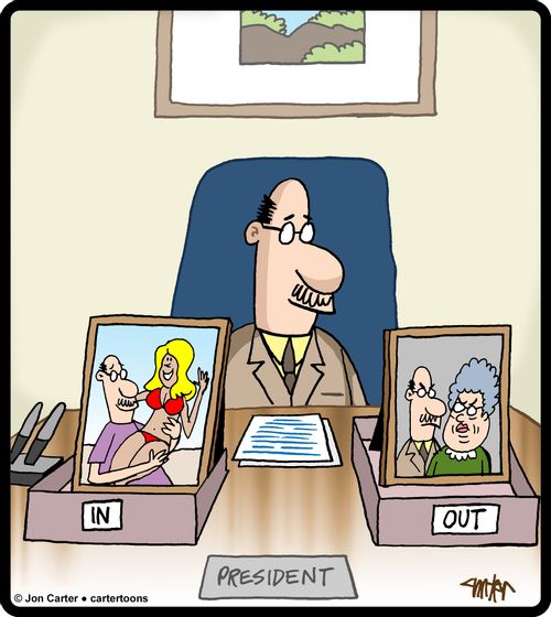 Business president with photo of his trophy wife in "IN" box, and another photo of his old wife in the 'OUT' box.