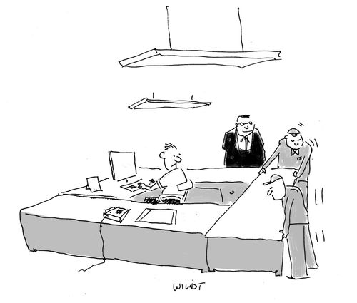 Man at work surrounded by office desks