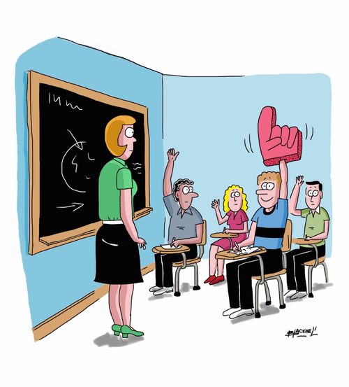 Student getting attention with foam sports hand.