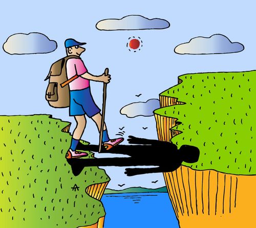 Tourist uses his shadow to cross a cliff.