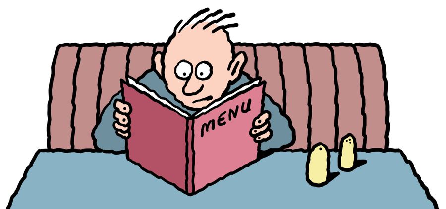 Anxious man reading restaurant menu