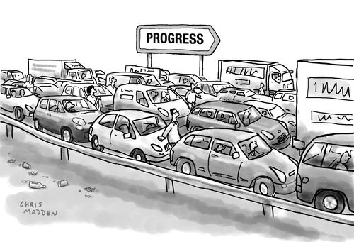 A traffic jam on a road signposted to 'Progress'.