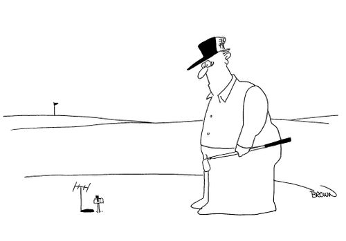 Golfer looking at golf hole with mailbox.
