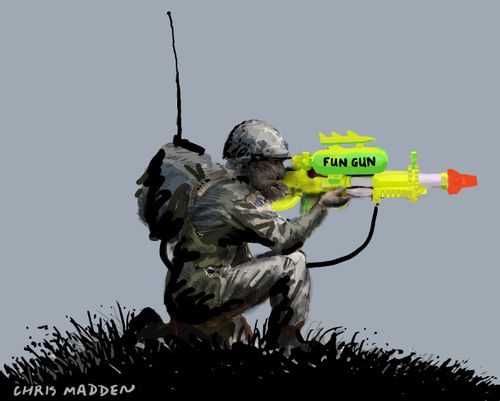 Boys and their Toys: Crouching soldier with water pistol as a gun.