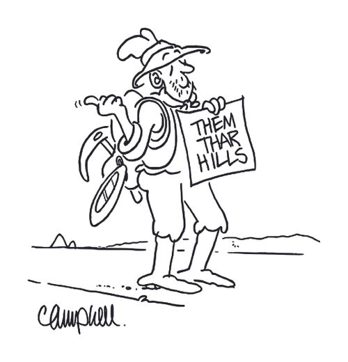 Guy with gold mining equipment holds sign saying 'them thar hills'.