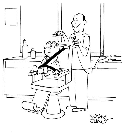Barber has strapped boy in barber chair with a safety belt.