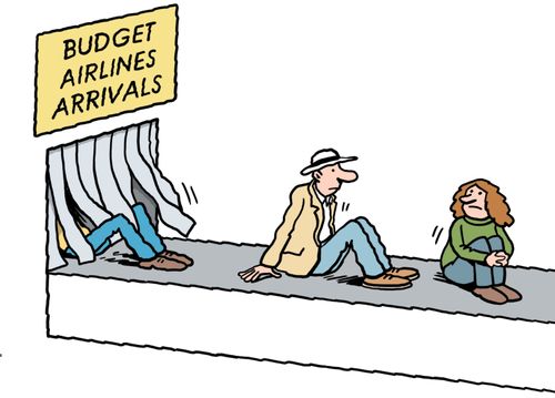 Passengers arriving on luggage conveyor belt