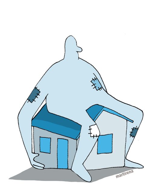 Man sits on house.