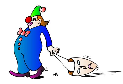 A clown drags a trestle theatre mask behind him.