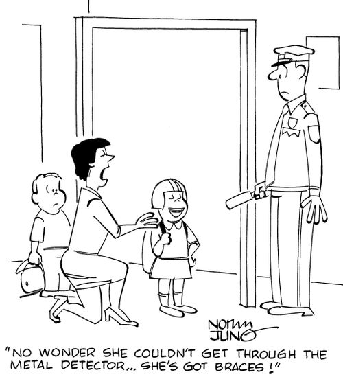 "No wonder she couldn't get through the metal detector...she's got braces!"
