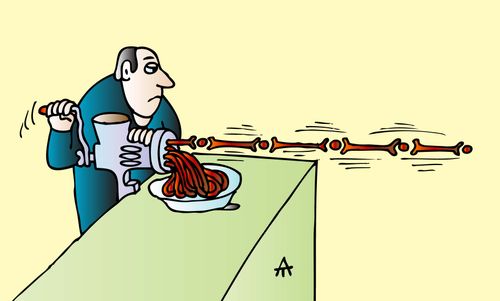 A man grinds bones into mince.