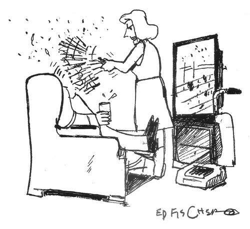 A woman dusts a man who is watching sports.