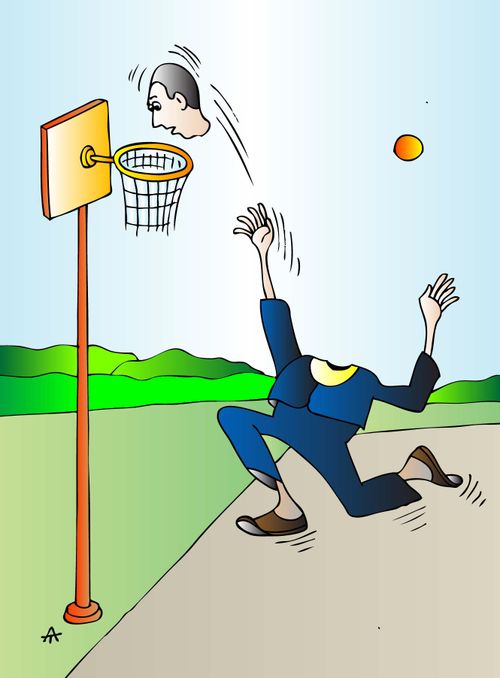 A man shoots his head at a basketball hoop.