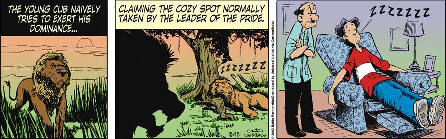 The young cub naively tries to exert his dominance...claiming the cozy spot normally taken by the leader of the pride.