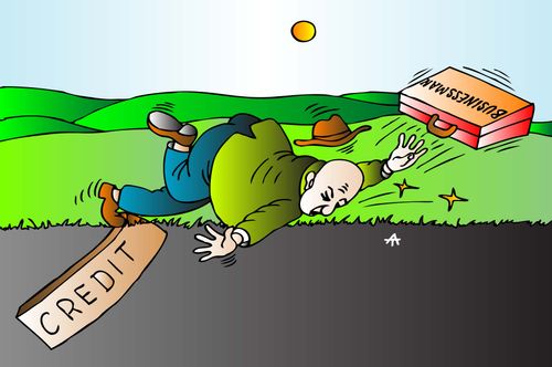 Businessman trips over credit