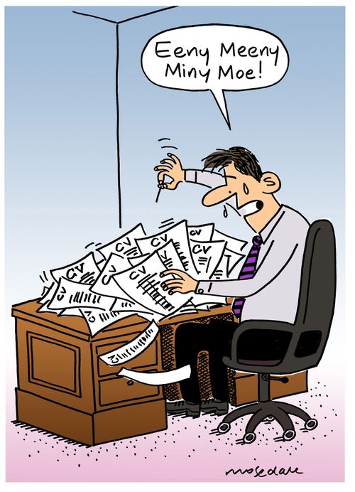 HR worker wading through CV's.