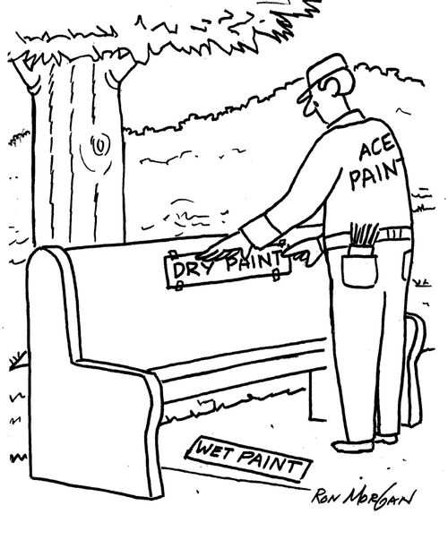 Painter removes 'wet paint' sign from park bench and replaces it with a 'dry paint' sign.