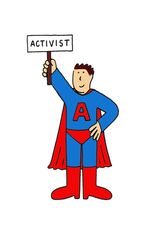 Activist in superhero outfit with a sign.