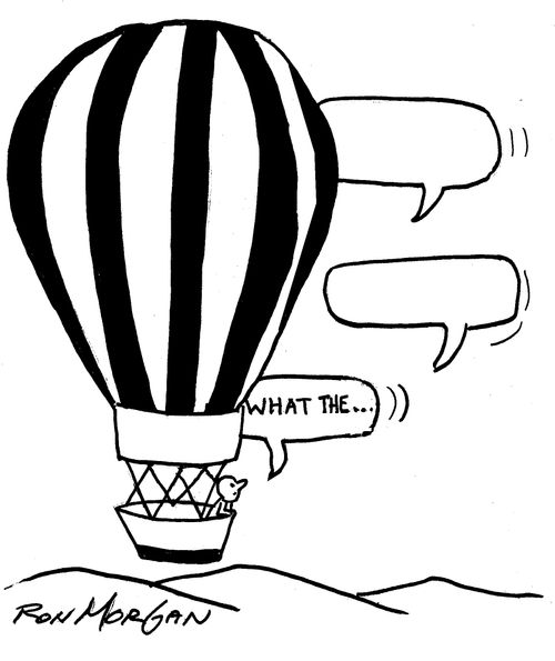 Man riding in a hot air balloon sees comic balloons floating by.