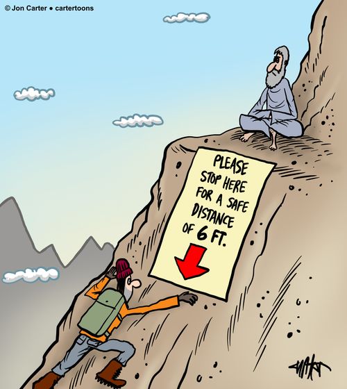 A mountain guru has a sign on his mountain for safe social distancing.