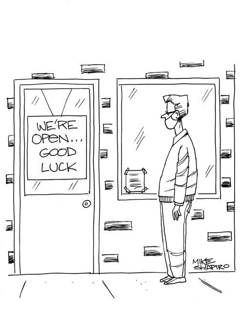 Restaurant with sign reading 'We're open... Good luck'.