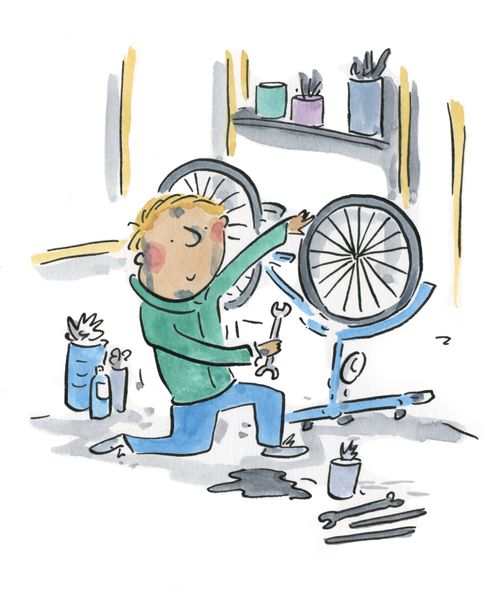 Man tinkers his bike.