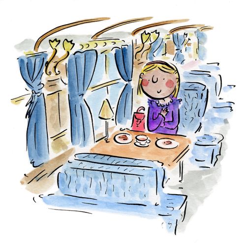 Woman having tea in a train carriage