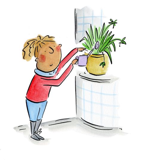 Girl waters a plant