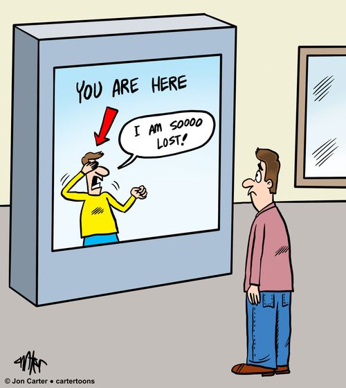 Man looking at poster making fun of him for being lost.