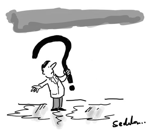 A man standing in a puddle and holding a question mark