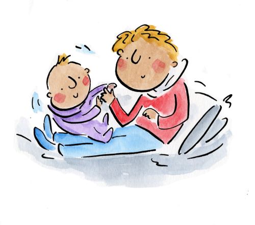 A man playing with a baby