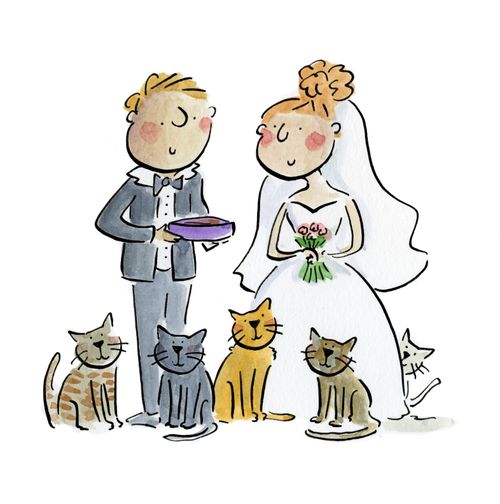 A bride and groom surrounded by cats