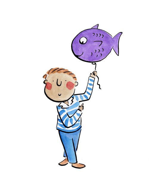 A boy holding a fish balloon