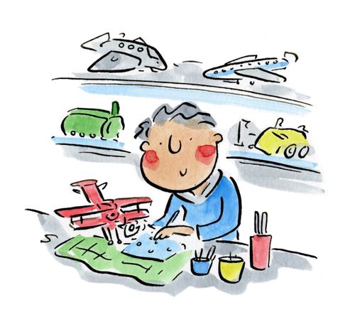 A man working on a model airplane