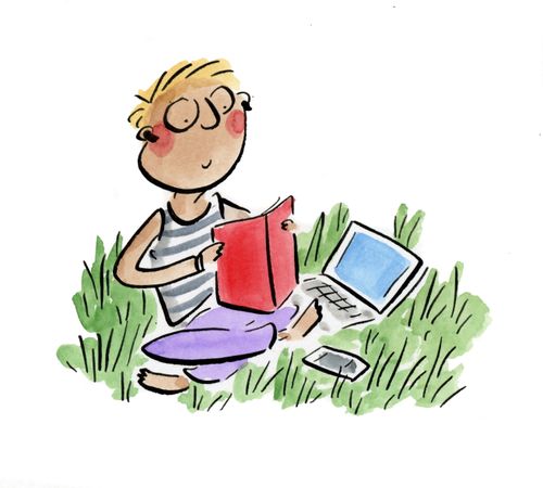 A man sitting in the grass reading